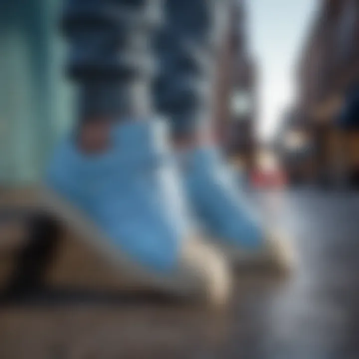 Fashion-forward individual wearing Adidas Superstar Light Blue in an urban setting.