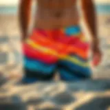 Vibrant board shorts displayed on a sandy beach