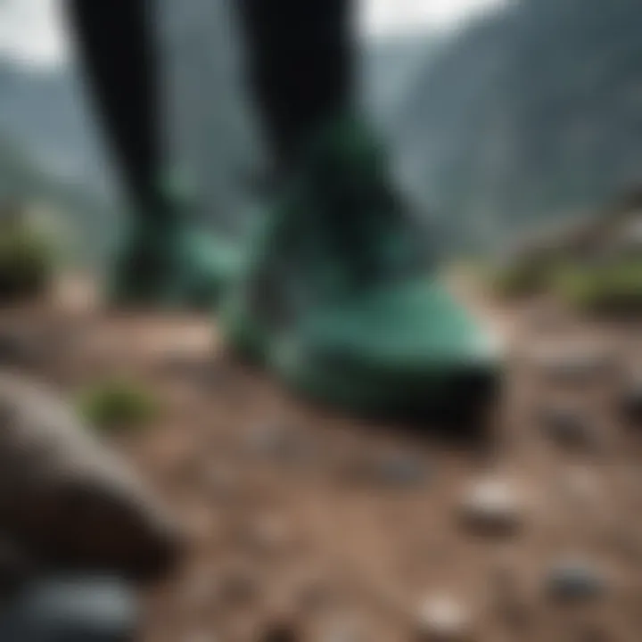 Dynamic black and green Adidas footwear on rugged terrain