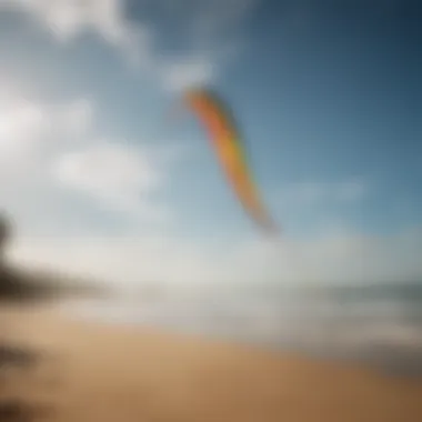 A vibrant Cabrinha kite soaring in the sky over a picturesque beach.