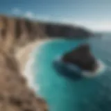 A breathtaking view of the cliffs along the Aruba coastline with turquoise waters below