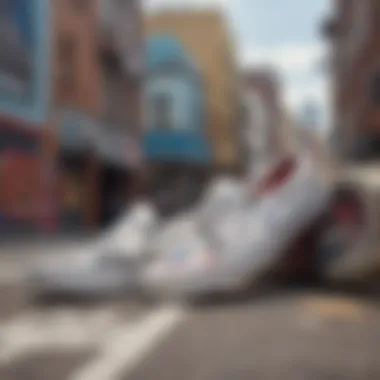 Close-up of white slip-on Vans with vibrant street art background