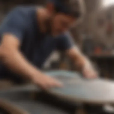 An artisan applying personalized graphics to a skateboard deck