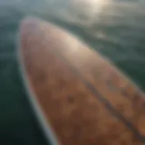 Detailed view of an epoxy paddleboard showcasing its glossy finish and unique design patterns