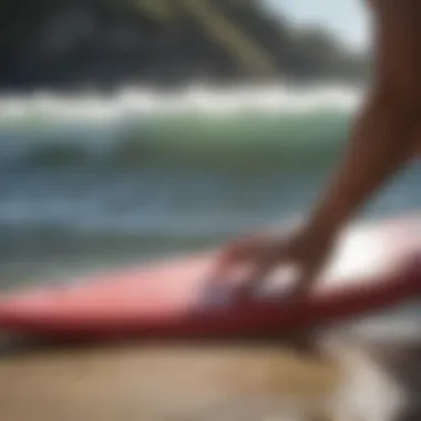 A close-up view of surfboard wax removal showing effective techniques.