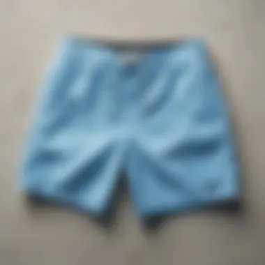 Innovative Design: The Craftsmanship of Light Blue Board Shorts Close-up of light blue board shorts highlighting innovative material and design features.