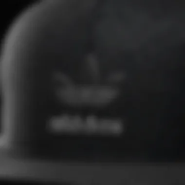 Close-up view of the fabric and stitching details of an Adidas snapback hat.