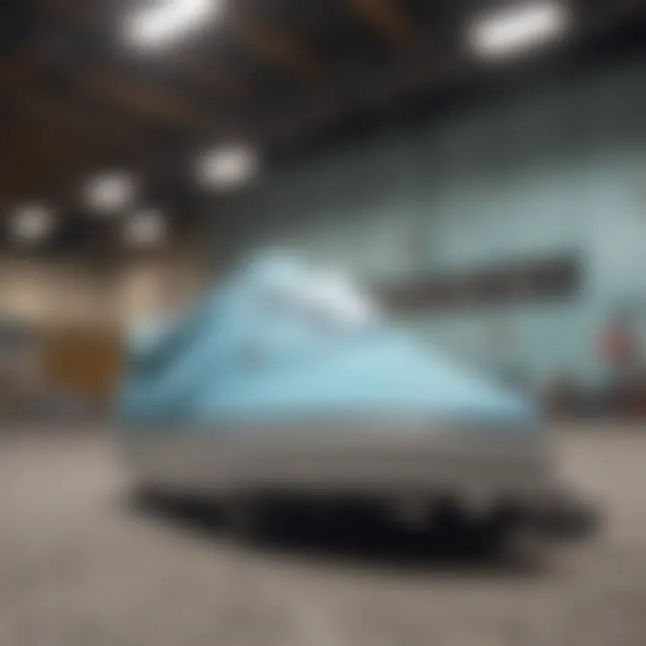 An extreme sports enthusiast wearing light blue Vans on a skate ramp.