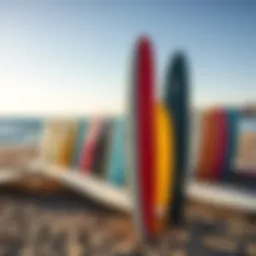 A vibrant collection of soft top surfboards lined up on the beach