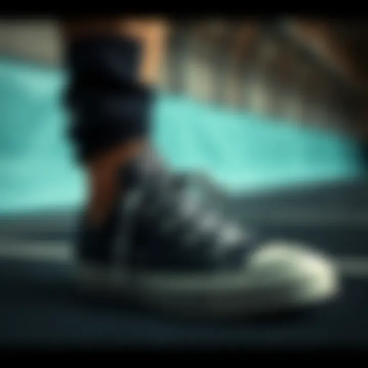 Performance and Practicality in Sports Black low top Converse in a sports environment.