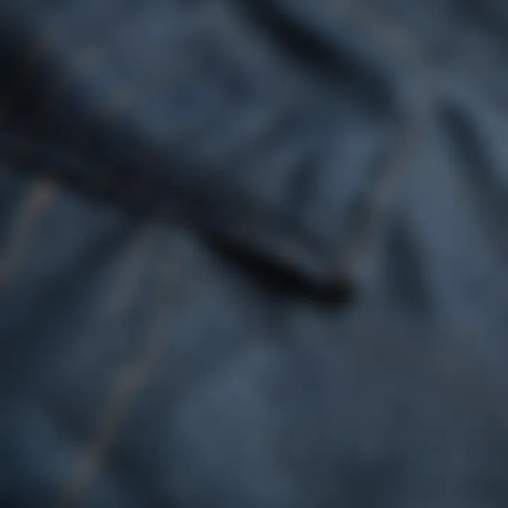 Close-up of the fabric and stitching of blue chinos