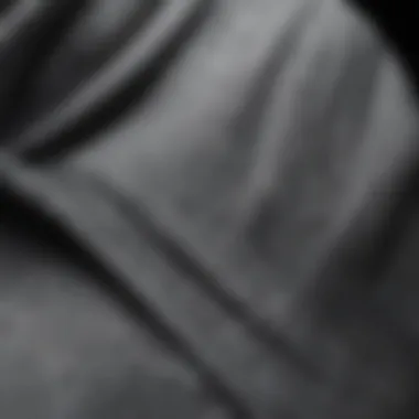 Textured Fabric of a Grey Hoodie Close-up view of a textured grey hoodie fabric