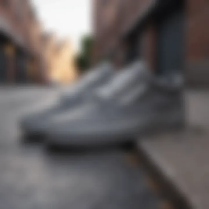 Gray Vans sneakers in an urban setting illustrating their adaptability.