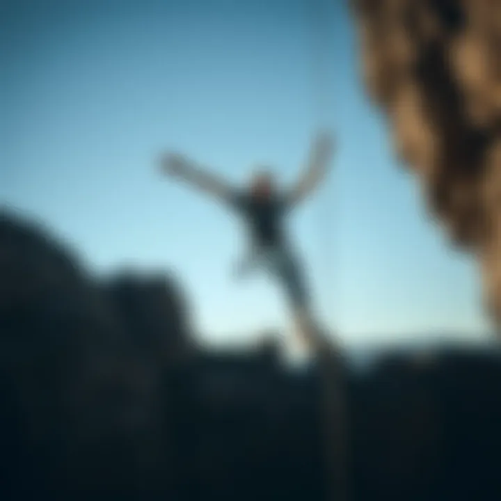 Rock climber showcasing the pad roll technique during a fall