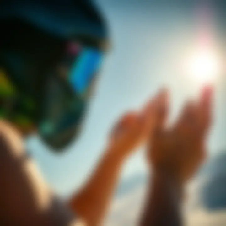 Extreme sports enthusiast applying sunscreen in bright sunlight