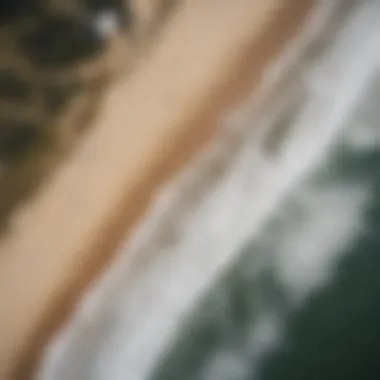 Aerial view of the Outer Banks coastline with surfers