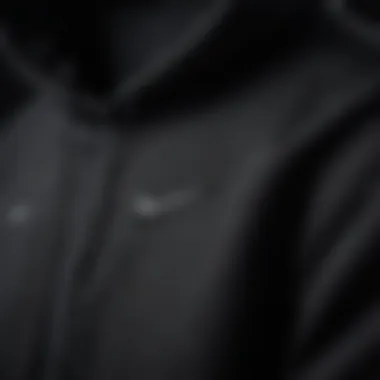 Close-up of the fabric and design details of the black Nike Air hoodie