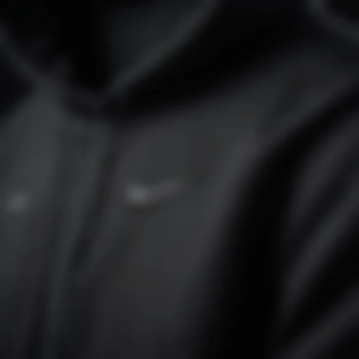 Close-up of the fabric and design details of the black Nike Air hoodie