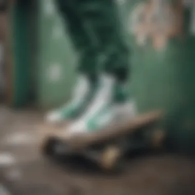 A pair of green and white Adidas high tops resting on a skateboard with urban graffiti in the background