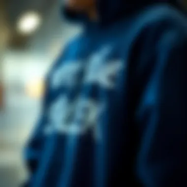 Artistic Expression on Navy Blue Hoodie Close-up of graphic design on navy hoodie