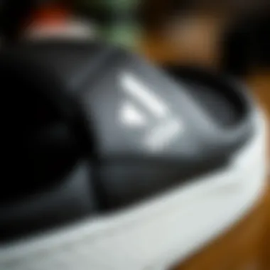 Craftsmanship of Adidas Slides Close-up of the stitching and logo on Adidas slides