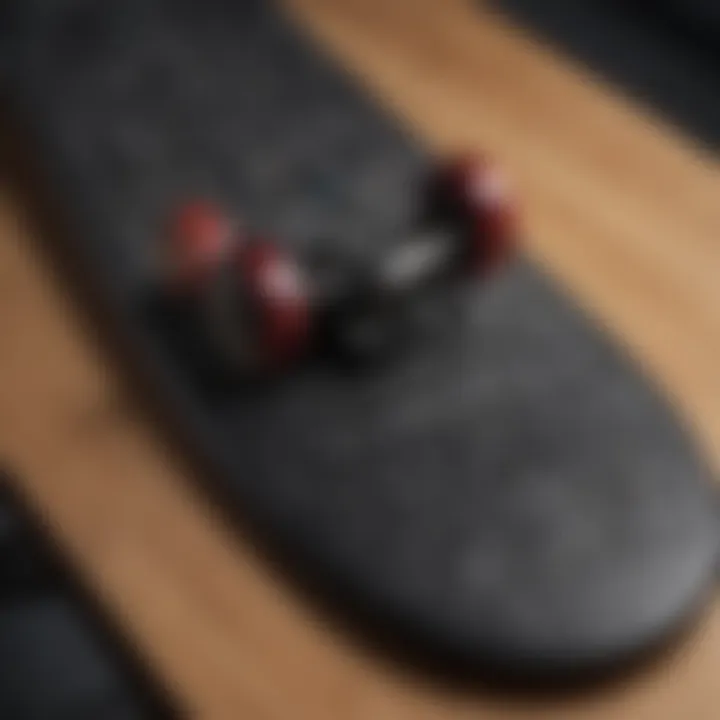 Close-up of the intricate design details of a black longboard deck