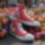 Colorful Converse high-tops adorned with spring flowers in a vibrant urban setting