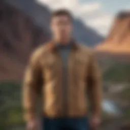 A rugged tan shirt jacket hanging on a scenic outdoor backdrop, showcasing its versatility.