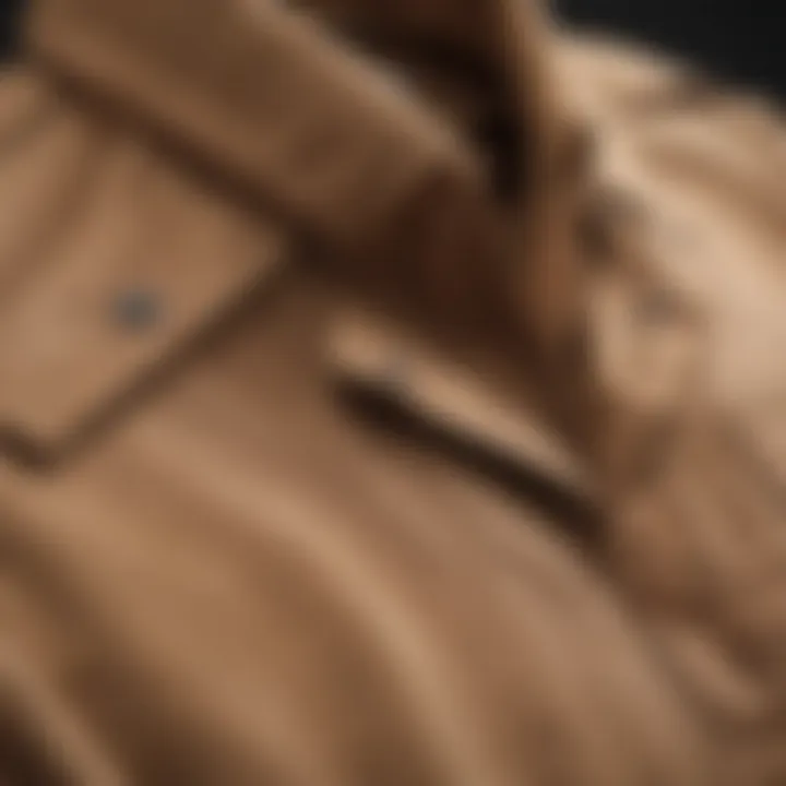 Close-up of the fabric texture of a tan shirt jacket, highlighting its durability and quality.