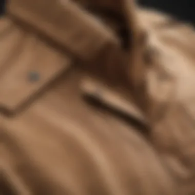 Fabric Texture of Tan Shirt Jacket Close-up of the fabric texture of a tan shirt jacket, highlighting its durability and quality.