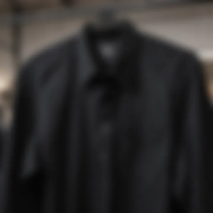 Classic black button-down shirt displayed on a hanger