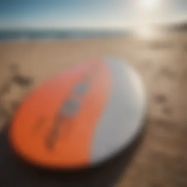 Close-up of essential skimboarding gear displayed on the beach