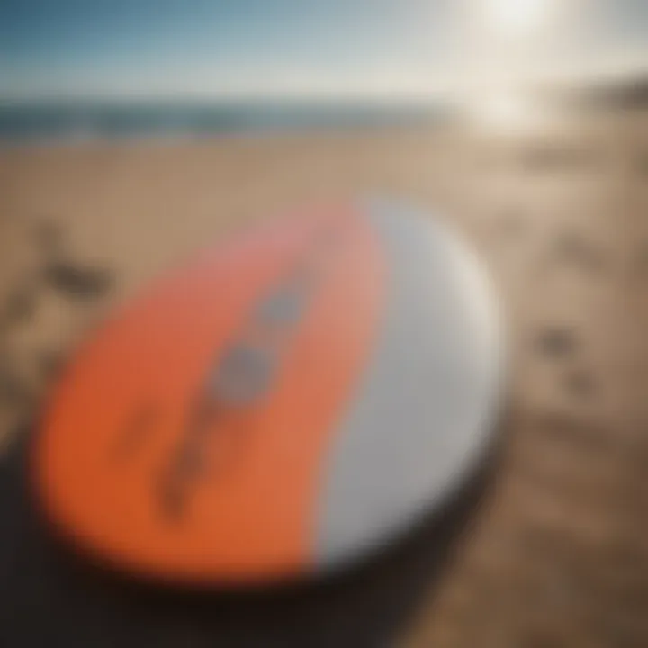 Close-up of essential skimboarding gear displayed on the beach