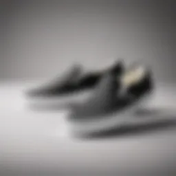 Classic black and white Vans Slip-Ons against a minimalist backdrop