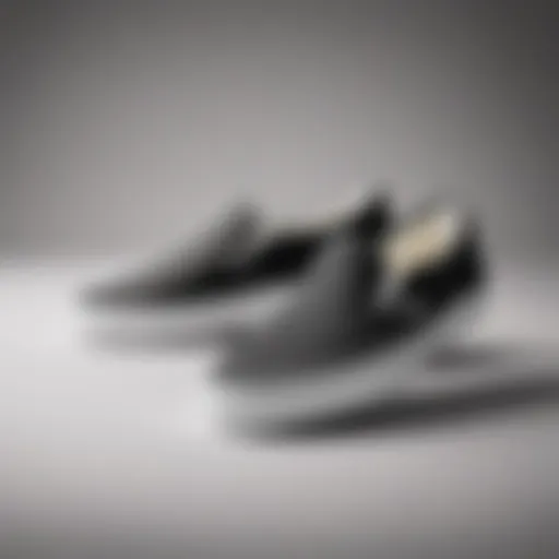 Classic black and white Vans Slip-Ons against a minimalist backdrop
