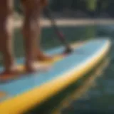 Detailed view of an inflatable paddle board with visible punctures.