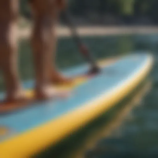 Detailed view of an inflatable paddle board with visible punctures.