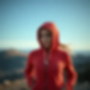 Active woman wearing zip front hoodie during outdoor exercise