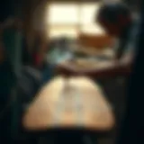 An artisan shaping a longboard with precision tools