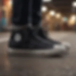 A close-up of low top black Chuck Taylor All Star sneakers on a skateboard