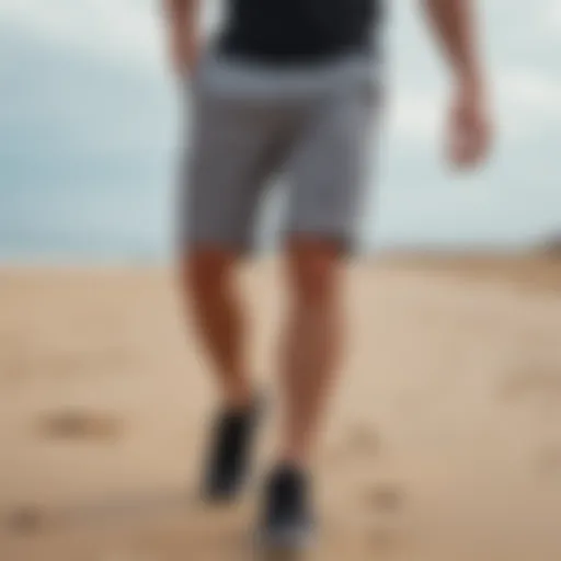 Stylish grey cotton shorts on a sandy beach