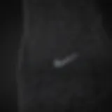 Close-up view of the fabric texture of Nike black socks