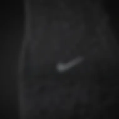 Close-up view of the fabric texture of Nike black socks