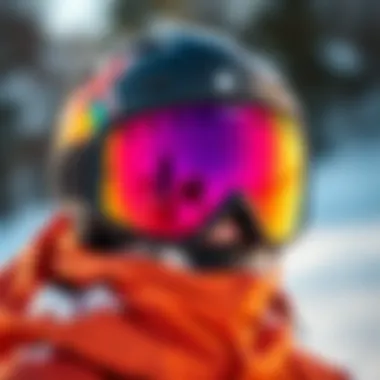 Stylish snowboarding goggles with a vibrant design against a snowy backdrop