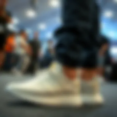 Celebrity wearing white and gold Adidas shoes at an event