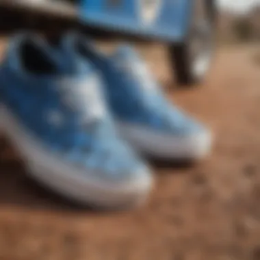 Close-up of blue and black checkered Vans with dirt bike