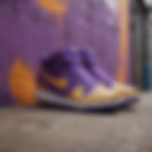Vibrant purple and gold Nike shoes against a graffiti wall