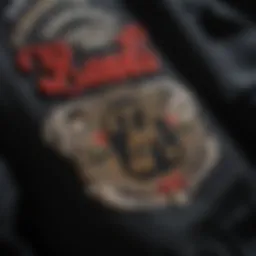 A close-up of a black letter jacket showcasing intricate embroidery and patches