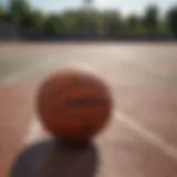 An outdoor basketball on a textured court