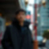 Stylish black coach jacket worn in an urban setting